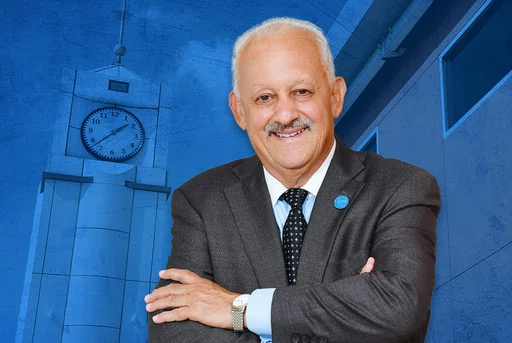 Tomás D. Morales in front of SMSU grunge backdrop