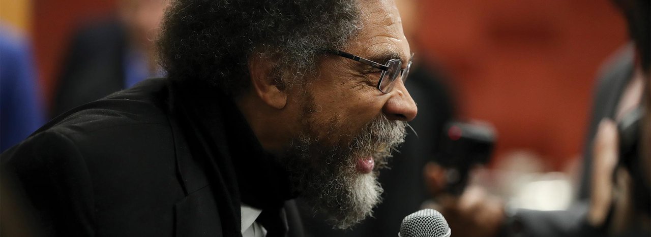 Cornel West in deep discussion with crowd 