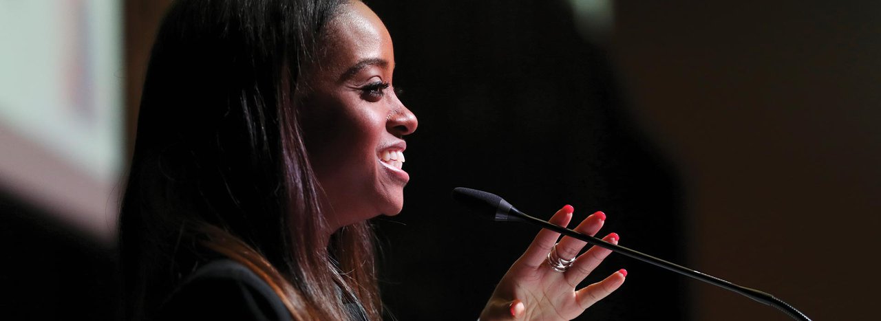 Female student speaking at Women’s Leadership Conference