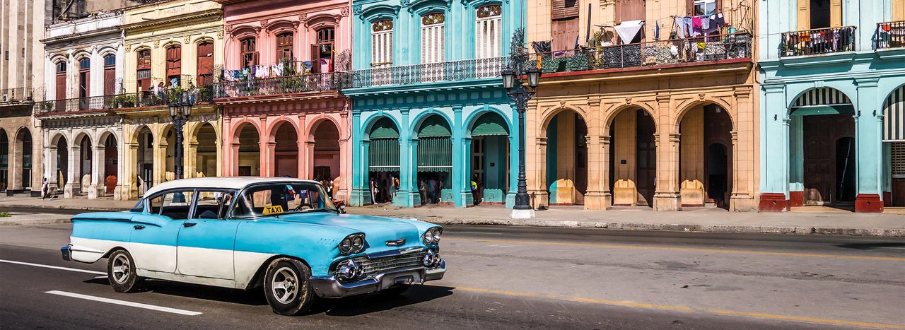 Classic car driving on Cuba street