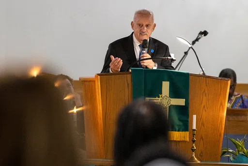 President Morales speaking at the St. Paul African Methodist Episcopal Church