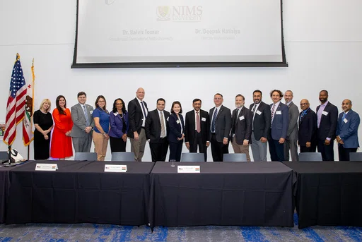 Representatives of CSUSB and NIMS University at the Dec. 6 signing of the memorandum of understandin