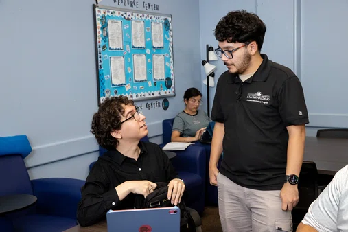 Jackson Archuleta talking to someone from the Student Mentoring Program