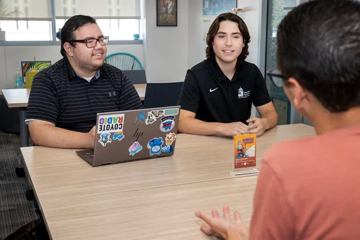 Harvey Orozco talking to other students