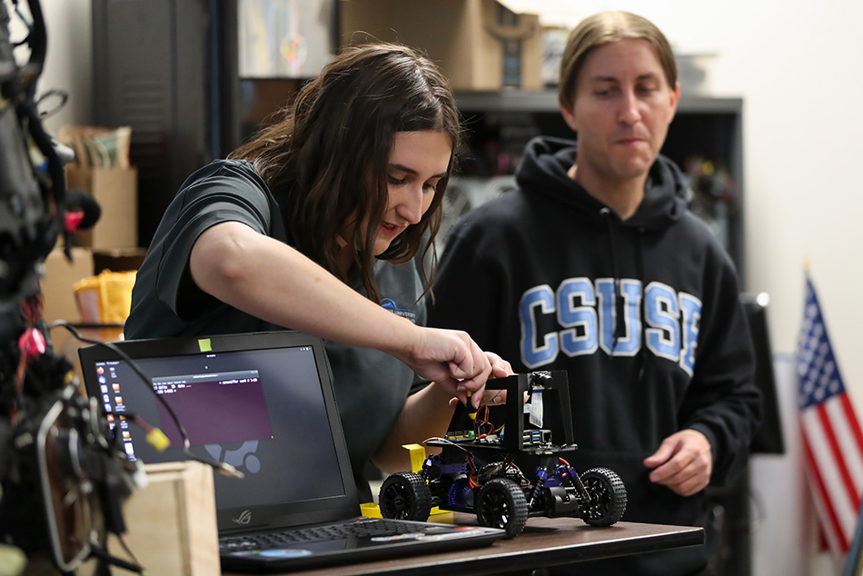 Students working on various electronic components