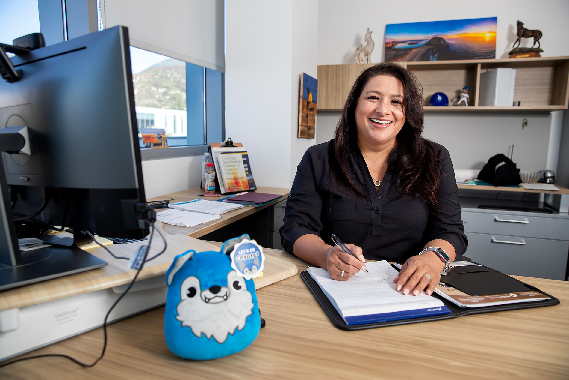 Angelica Agudo working in her office.