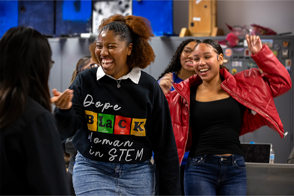 House laughing with classmates