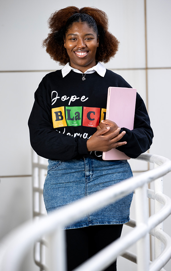 House posing with laptop