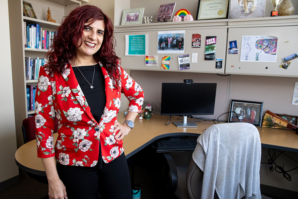 Badiee posing by her office desk