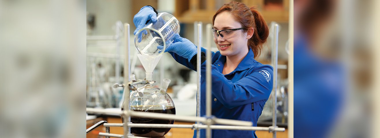 CSUSB student performs tasks in a lab. 