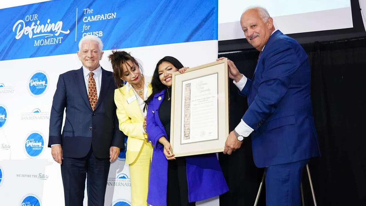 Jim and Judy Watson pose with President Morales