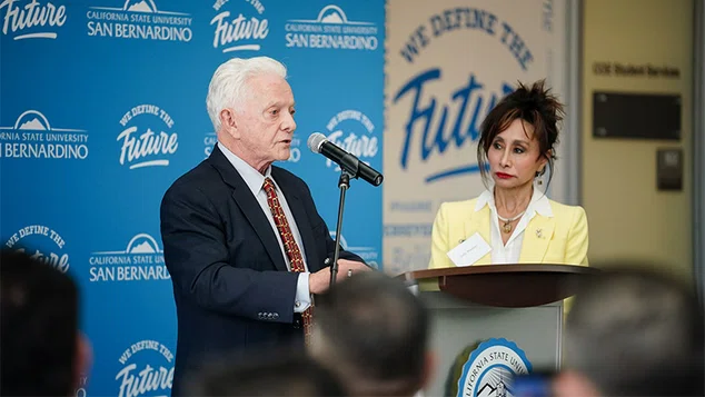 Jim and Judy Watson at podium